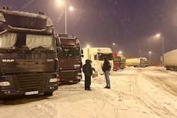 Ukrainian truck drivers wait to cross from Poland back into Ukraine, Korczowa, Poland, Dec. 7, 2023.