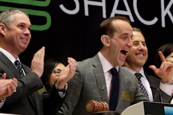 Shake Shack CEO Randy Garutti, center, celebrates during opening bell ceremonies at the New York Stock Exchange, Jan. 14, 2016.
