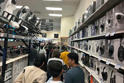 Patrons stand in line at a Micro Center store in Yetta, Ga., Nov. 24, 2023.