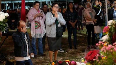 Devotees pray at St. Ann Mission in Naranja, Fla., Dec. 10, 2023.