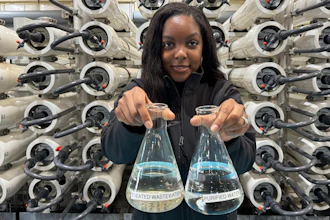 Lakeisha Bryant, public information representative at the Santa Clara Valley Water District, holds flasks of water before and after it is purified at the Silicon Valley Advance Purification Center, Dec. 13, 2023, San Jose.