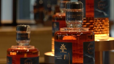 In this image from video, 'The Chuan' pure-malt whisky is displayed at the Chuan Malt Distillery, Emeishan, China, Dec. 13, 2023.