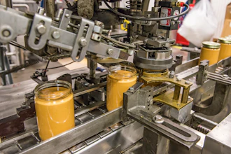 The peanut butter capper at Once Again's factory.