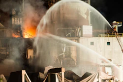Firefighters work at the scene following an explosion and fire at the Didion Milling plant, Cambria, Wis., June 1, 2017.