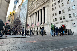 People gather near the New York Stock Exchange, Jan. 2, 2024.
