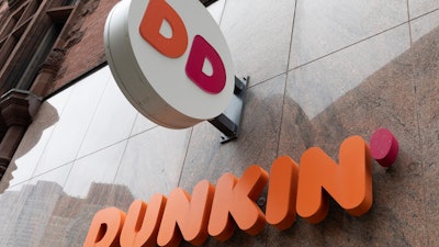 The Dunkin' logo on a storefront in Boston, Oct. 14, 2022.