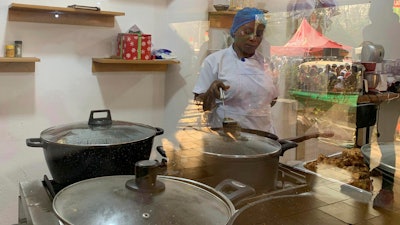 Chef Failatu Abdul-Razak attempts to break a world record for marathon cooking in Tamale, Ghana, Jan. 5, 2024.