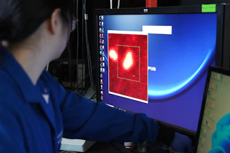 Columbia chemist Naixin Qian zooms in on an image generated from a microscope scan, New York, Jan. 8, 2024.