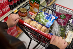 A shopper pushes a cart of groceries at a supermarket in Bellflower, Calif., Feb. 13, 2023.