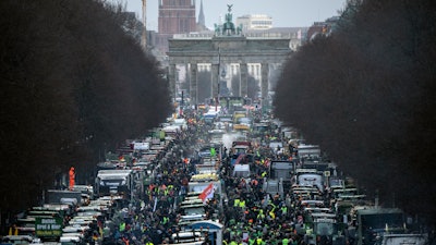 Farmers protest at the Brandenburg Gate in Berlin, Jan. 15, 2024.