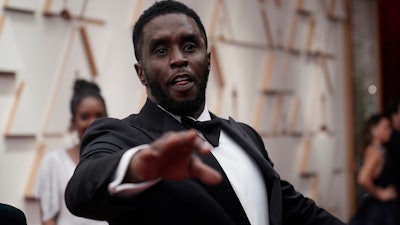 Sean Combs arrives at the Oscars at the Dolby Theatre in Los Angeles, March 27, 2022.