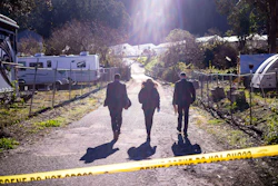 FBI officials walk towards the crime scene at Mountain Mushroom Farm, Half Moon Bay, Calif., Jan. 24, 2023.