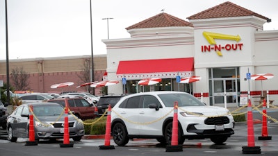 Customers line up at the In-N-Out drive-thru off Hegenberger Road in Oakland, Calif., Jan. 22, 2024.