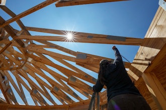Workers build a home in Marshall, N.C., Sept. 19, 2023.