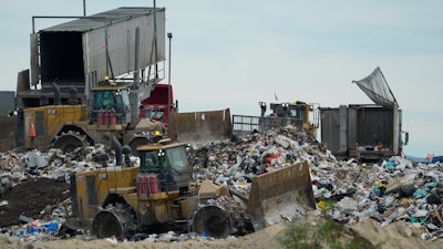 Heavy machinery processes trash at the Otay Landfill, Chula Vista, Calif., Jan. 26, 2024.