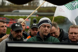 Farmers watch French Prime Minister Gabriel Attal announcing new measures for farmers, Chilly-Mazarin, France, Feb.1, 2024.