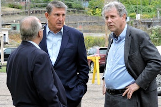 U.S. Sens. Joe Manchin, D-W.Va., center, and Sherrod Brown, D-Ohio, right, speak with Cleveland-Cliffs CEO Lourenco Goncalves, Weirton, W.Va., Sept. 26, 2023.