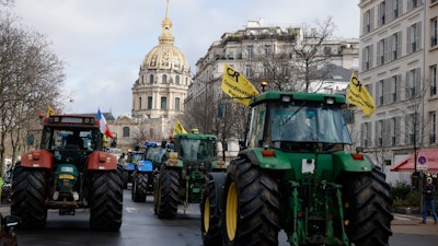 Farmers drive their tractors during a protest in Paris, Feb. 23, 2024.