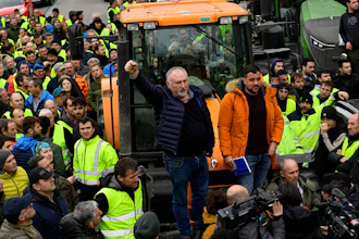 Farmers with their tractors attend a protest in Pamplona, northern Spain, Friday, Feb. 9, 2024. For fourth non stop days, farmers in Spain have staged tractor protests across the country, blocking highways and causing traffic jams to demand of changes in EU policies and funds and measures to combat production cost hikes.