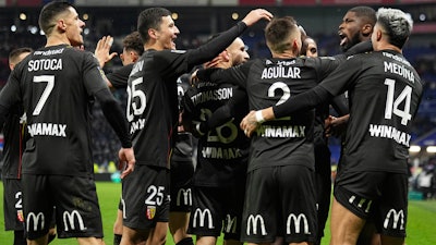 Lens' Kevin Danso celebrates with teammates after scoring against Lyon at the Groupama stadium, Décines-Charpieu, France, March 3, 2024.