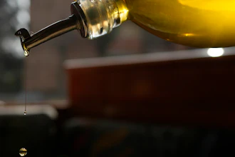 Olive oil poured into a salad at the 'Gelateria di Pontesesto' Bar, Rozzano, Italy, March 8, 2024.