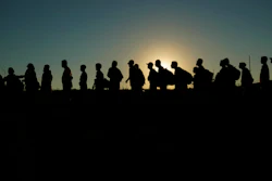 Migrants lined up for processing by U.S. Customs and Border Protection, Eagle Pass, Texas, Sept. 23, 2023.