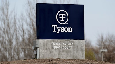 A sign sits in front of the Tyson Foods pork plant, April 22, 2020, in Perry, Iowa.