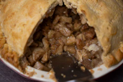 A country apple pie is sliced at Michele's Pies, Norwalk, Conn., March 13, 2024.