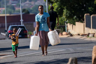 Residents line up for water, Soweto, South Africa, March 16, 2024.