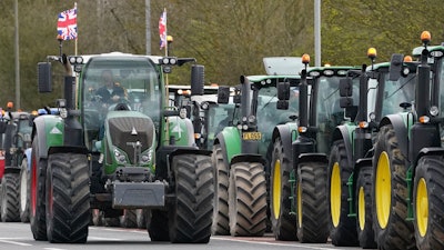 A convoy of farmers in tractors gather on the A20 near Wrotham, England, March 25, 2024.