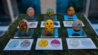 Eggs designed by children of members of the military adorn the East Colonnade of the White House, March 28, 2024.