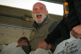 Jose Andres, a Spanish chef and founder of World Central Kitchen, unloads humanitarian food packages, Kherson, Ukraine, Nov. 15, 2022.