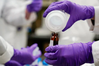 Water researcher Eva Stebel pours a sample at the EPA Center for Environmental Solutions and Emergency Response, Cincinnati, Feb. 16, 2023.
