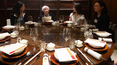 Treasury Secretary Janet Yellen, center, speaks, during a lunch meeting with women economists in Beijing, July 8, 2023.