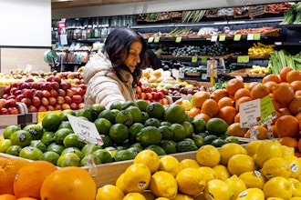 A woman browses produce at a grocery store in New York, Jan. 19, 2024.