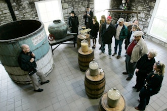 Guide Dave Salyers describes the bourbon-making process to a group touring the Woodford Reserve distillery, Versailles, Ky., April 8, 2009.