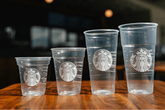 This photo provided by Starbucks shows a new version of the company's cold cup which is said to be made with up to 20% less plastic.
