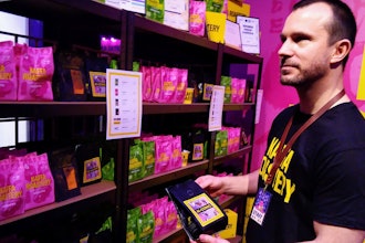 Kaffa Roastery founder Svante Hampf shows package of 'AI-conic' coffee blend, Helsinki, April 19, 2024.