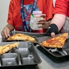 Second-grade students select meals in the cafeteria of an elementary school in Scottsdale, Ariz., Dec. 12, 2022.