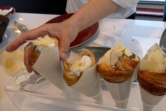 Twisted croissants with artichoke puree, a poached egg, a bit of truffle and a bit of cheese, created by French chef Amandine Chaignot, shown in Paris, April 30, 2024.