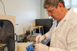 Auburn University Research Professor Burak Aksoy working on gas sensor components.