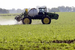A soybean field is sprayed in Iowa, July 11, 2013. The maker of a popular weedkiller is turning to lawmakers in key states to try to squelch legal claims that it failed to warn about cancer risks.