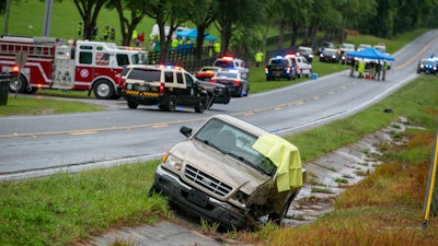 Emergency personnel respond to the scene of a deadly crash near Dunnellon, Fla., May 14, 2024.