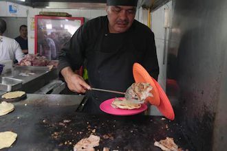 Chef Arturo Rivera Martínez at the Tacos El Califa de León taco stand, Mexico City, May 15, 2024.