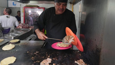 Chef Arturo Rivera Martínez at the Tacos El Califa de León taco stand, Mexico City, May 15, 2024.