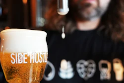 Mitchell Dougherty, brewmaster at Side Hustle Brews and Spirts, pours a beer at its pub in Abu Dhabi, United Arab Emirates, May 13, 2024.