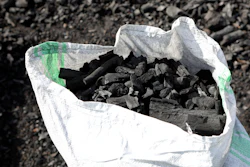 A sack of charcoal is filled in Gulu, Uganda, May 27, 2023.
