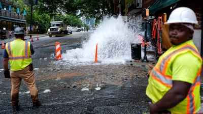 Workers respond to a broken water transmission line, Atlanta, June 1, 2024.