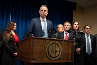 Assistant U.S. Attorney Joe Thompson, surrounded by the prosecution's trial team.