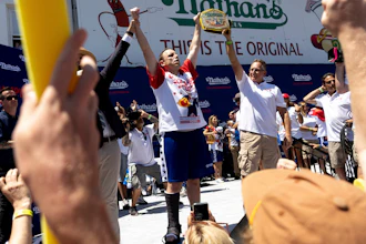 Joey Chestnut celebrates winning the Nathan's Famous Fourth of July hot dog eating contest in Coney Island in 2022.